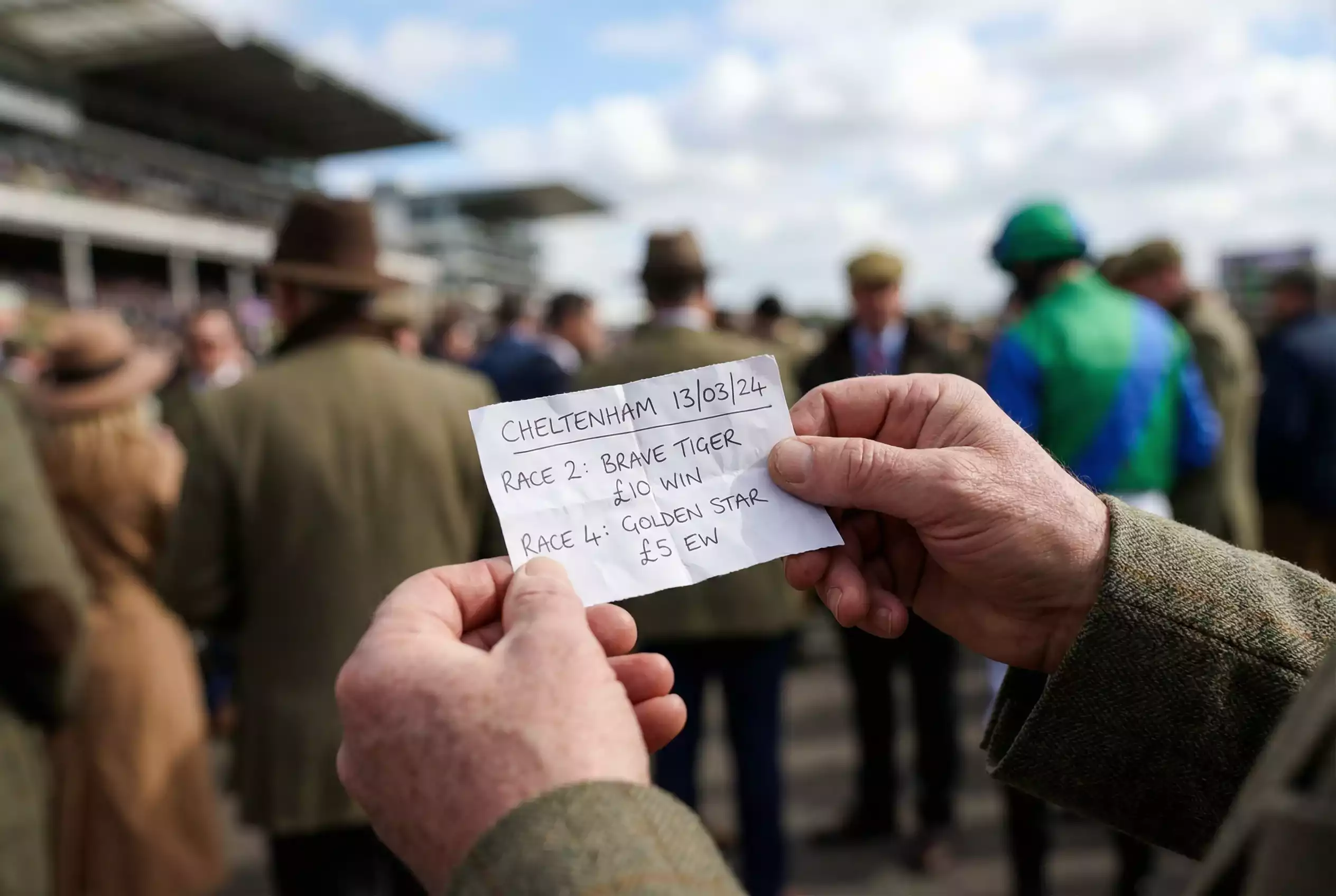 Punter studying a betting slip before a major horse racing festival