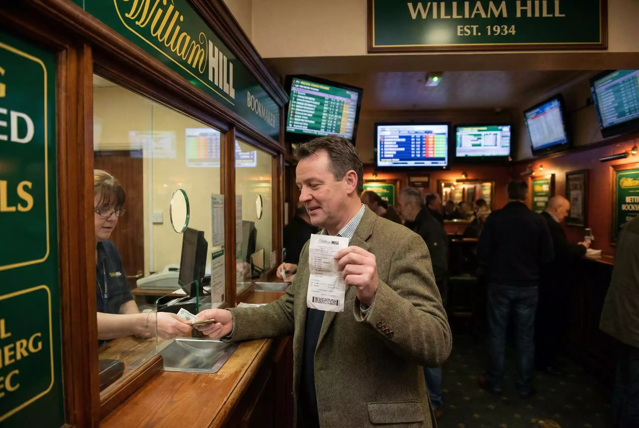 Non runner bet refund — punter receiving betting slip refund at bookmaker counter