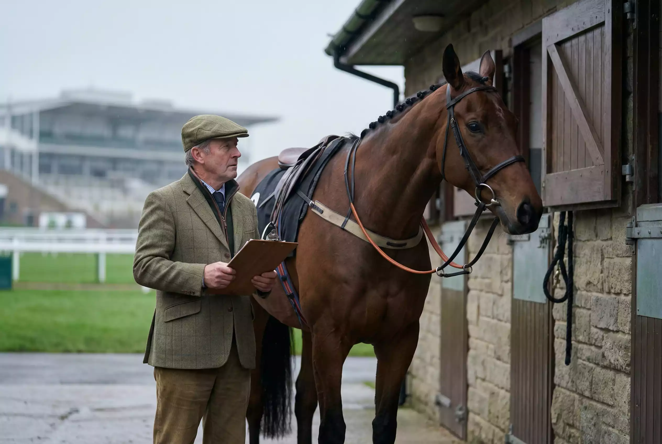 Non runner meaning in horse racing — trainer with horse at racecourse